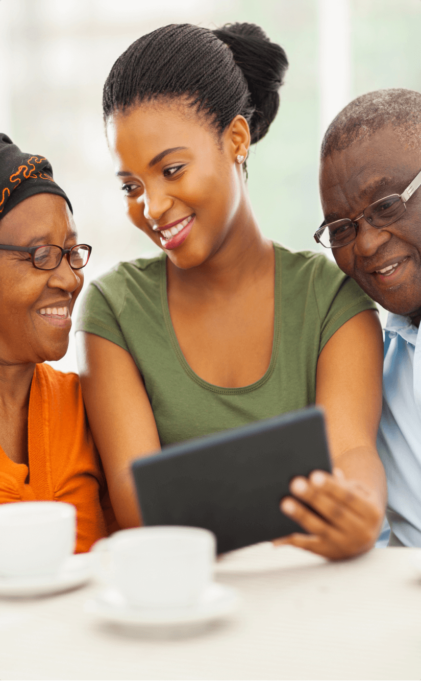 A family using a tablet together at home