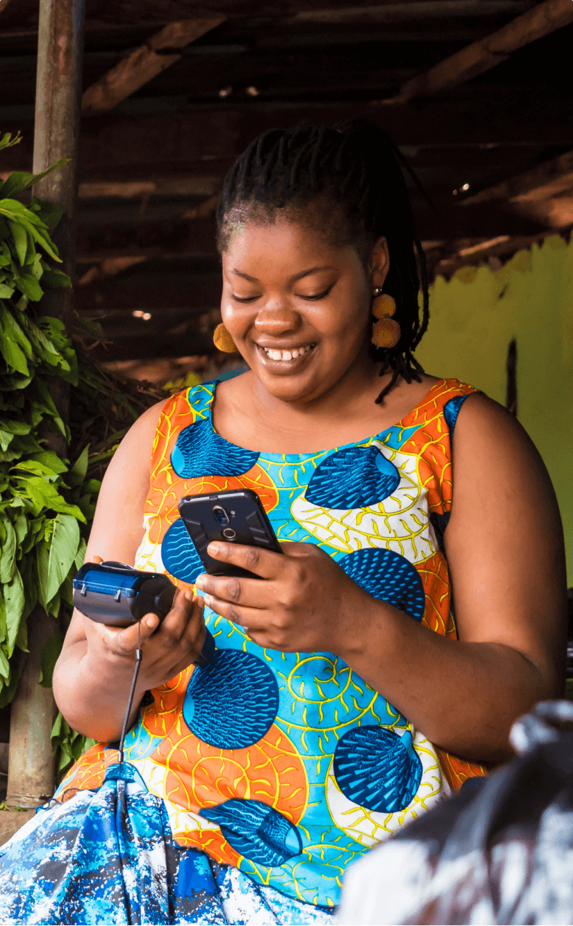 A trader taking a payment on a POS terminal